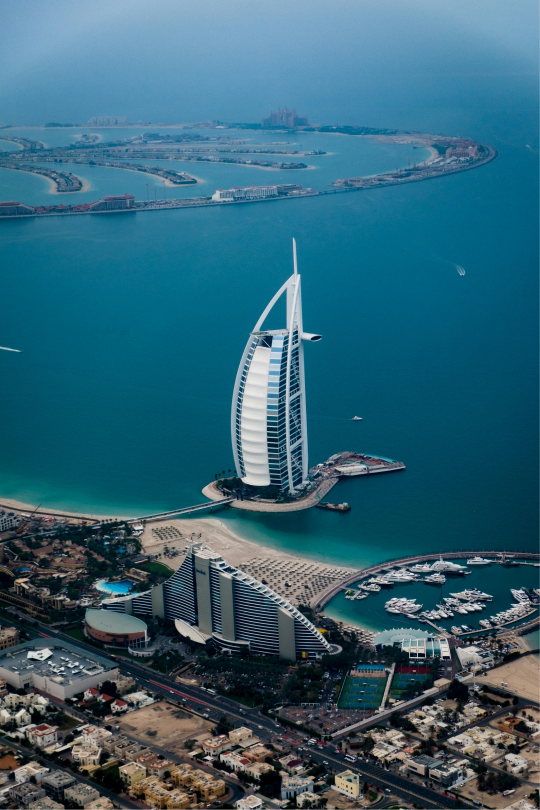 Aerial view of the Burj Al Arab and surrounding coastline in Dubai, symbolizing luxury travel and UAE connectivity.
