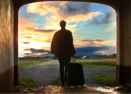 A traveler embarks on a new adventure, inspired by the beauty of the open road and a stunning sunset.